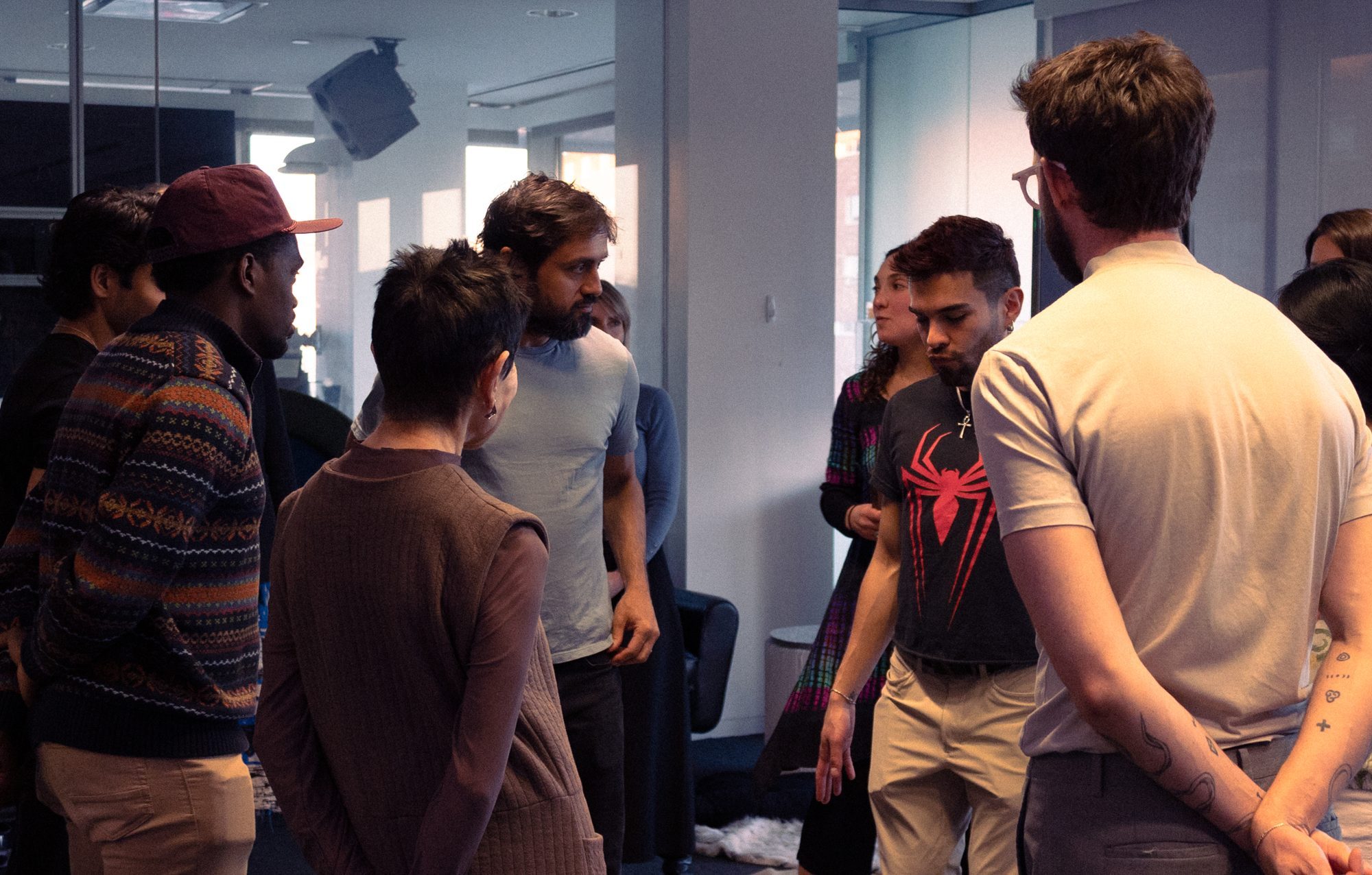 Participants standing in a circle during a New Social Forms session