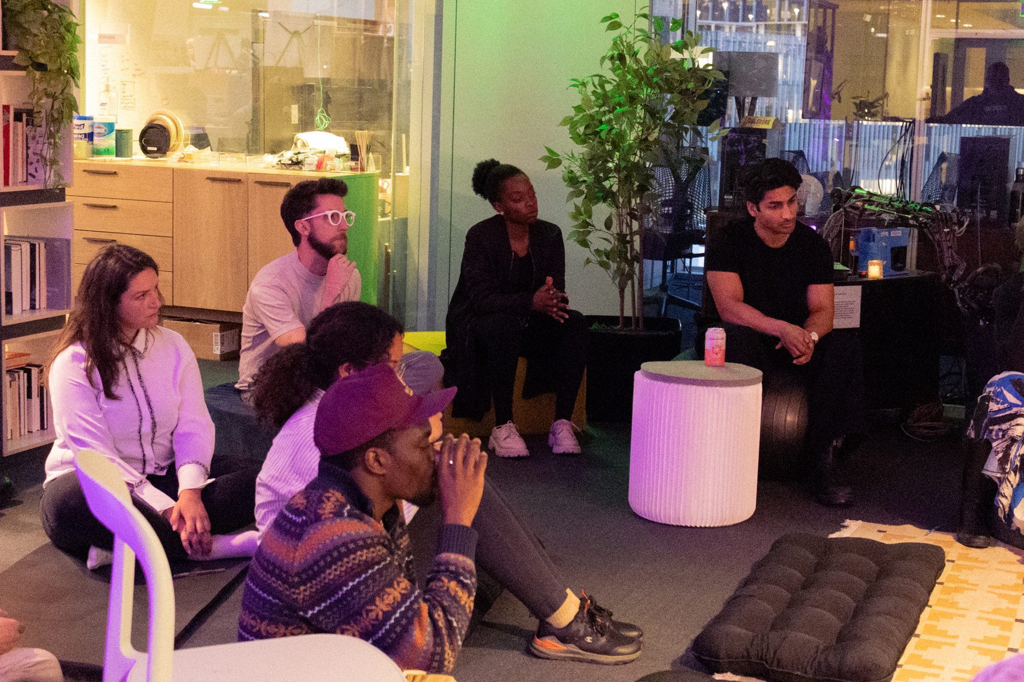 Participants listening in a circle during a salon